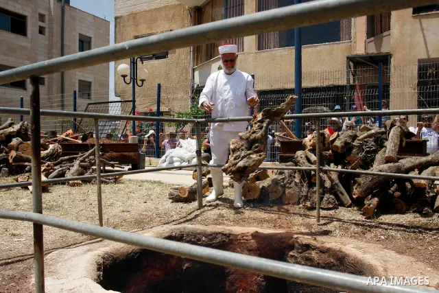 Members of the Samaritan sect prepare a traditional oven with mud during the traditional Passover sacrifice in Mount Gerizim, in the northern West Bank city of Nablus, 04 May 2012. According to tradition, the Samaritans...