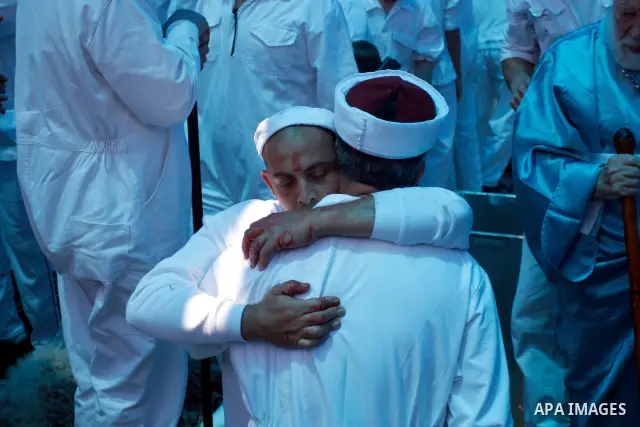 Samaritan priests and members of the ancient Samaritan community prepare the oven during the traditional Passover sacrifice ritual in Mount Gerizim, in the northern West Bank city of Nablus, 04 May 2012. According to tra...