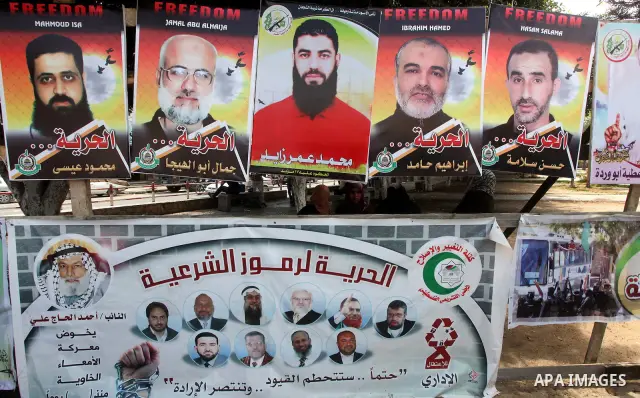 Relatives of hunger striking Palestinian inmates of Israeli prisons hold portraits during a sit-in solidarity protest in a tent, in Gaza City, Gaza Strip, on 04 May 2012. Protests continued in solidarity with hundreds of...