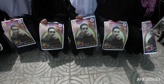 Relatives of hunger striking Palestinian inmates of Israeli prisons hold portraits during a sit-in solidarity protest in a tent, in Gaza City, Gaza Strip, on 04 May 2012. Protests continued in solidarity with hundreds of...