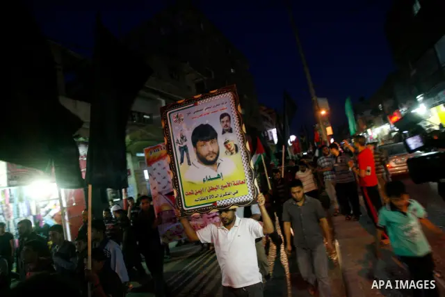 Supporters of Palestinian Democratic Front participate in a rally supporting Palestinian inmates on hunger strike since mid-April 2012, in Gaza City, May 6, 2012. A Palestinian rights group said recently that half of abo...