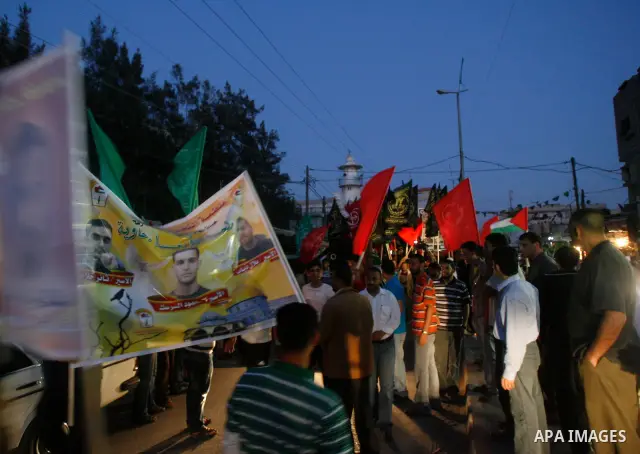 Supporters of Palestinian Democratic Front participate in a rally supporting Palestinian inmates on hunger strike since mid-April 2012, in Gaza City, May 6, 2012. A Palestinian rights group said recently that half of abo...