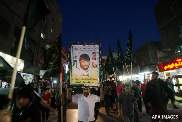 Supporters of Palestinian Democratic Front participate in a rally supporting Palestinian inmates on hunger strike since mid-April 2012, in Gaza City, May 6, 2012. A Palestinian rights group said recently that half of abo...