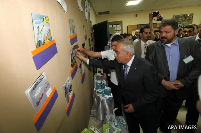 Palestinian Prime Minister, Salam Fayyad, attends opening of the exhibition of Fine Arts at An-Najah University National, in the West Bank town of Nablus, May 6, 2012. Photo by Mustafa Abu Dayeh