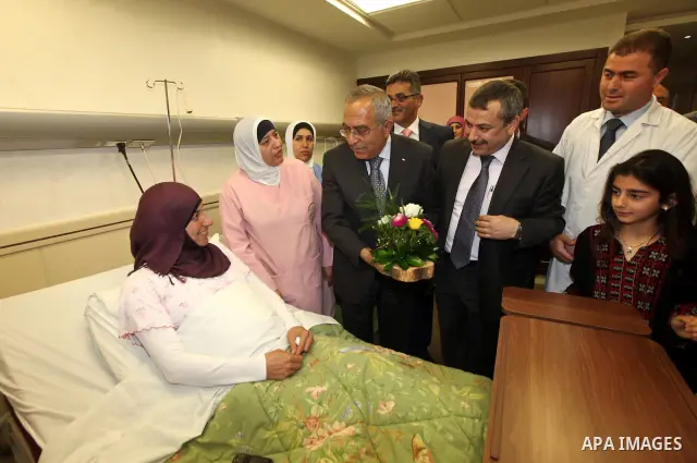 Palestinian Prime Minister, Salam Fayyad,attends opening of the maternity department in the Arab hospital specialist, in the West Bank town of Nablus, May 6, 2012. Photo by Mustafa Abu Dayeh