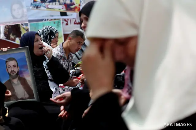Palestinian women attend a rally in Gaza City, to show solidarity with Palestinian prisoners held in Israeli jails on May 7, 2012. At least 1,550 Palestinian prisoners are refusing food in Israeli jails in a protest agai...