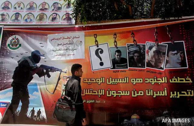 A Palestinian attends a rally in Gaza City, to show solidarity with Palestinian prisoners held in Israeli jails on May 7, 2012. At least 1,550 Palestinian prisoners are refusing food in Israeli jails in a protest against...
