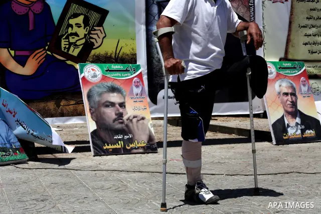 A Palestinian attends a rally in Gaza City, to show solidarity with Palestinian prisoners held in Israeli jails on May 7, 2012. At least 1,550 Palestinian prisoners are refusing food in Israeli jails in a protest against...