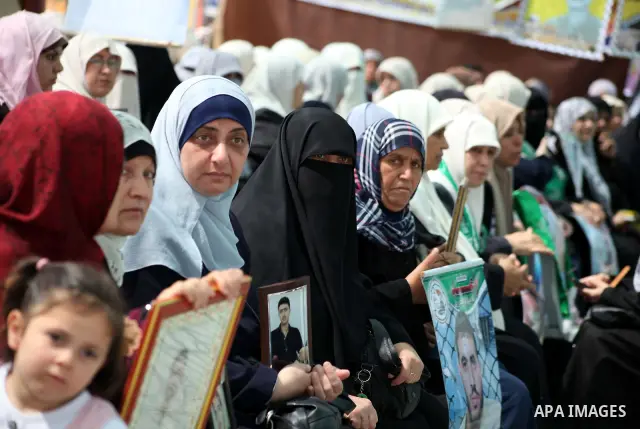 Palestinian women attend a rally in Gaza City, to show solidarity with Palestinian prisoners held in Israeli jails on May 7, 2012. At least 1,550 Palestinian prisoners are refusing food in Israeli jails in a protest agai...