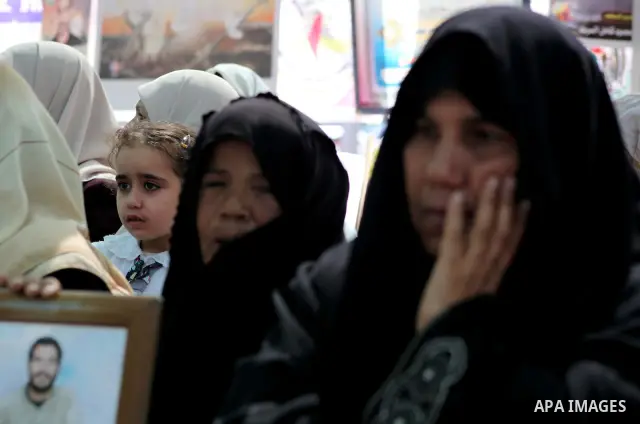 Palestinian women attend a rally in Gaza City, to show solidarity with Palestinian prisoners held in Israeli jails on May 7, 2012. At least 1,550 Palestinian prisoners are refusing food in Israeli jails in a protest agai...