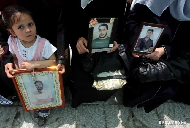 Palestinian women attend a rally in Gaza City, to show solidarity with Palestinian prisoners held in Israeli jails on May 7, 2012. At least 1,550 Palestinian prisoners are refusing food in Israeli jails in a protest agai...