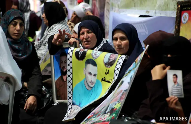 Palestinian women attend a rally in Gaza City, to show solidarity with Palestinian prisoners held in Israeli jails on May 7, 2012. At least 1,550 Palestinian prisoners are refusing food in Israeli jails in a protest agai...