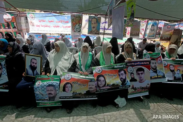 Palestinian women attend a rally in Gaza City, to show solidarity with Palestinian prisoners held in Israeli jails on May 7, 2012. At least 1,550 Palestinian prisoners are refusing food in Israeli jails in a protest agai...