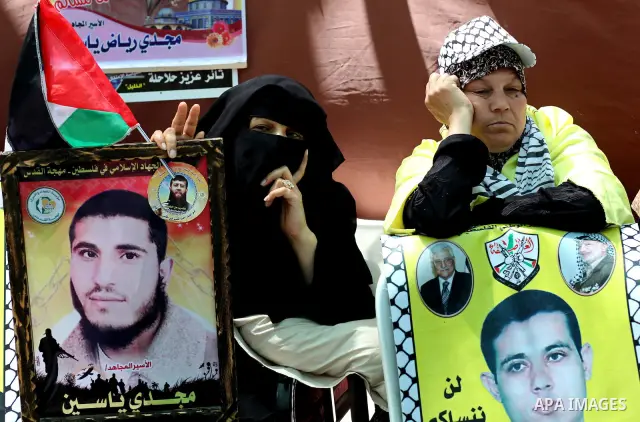 Palestinian women attend a rally in Gaza City, to show solidarity with Palestinian prisoners held in Israeli jails on May 7, 2012. At least 1,550 Palestinian prisoners are refusing food in Israeli jails in a protest agai...