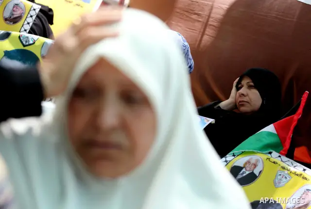 Palestinian women attend a rally in Gaza City, to show solidarity with Palestinian prisoners held in Israeli jails on May 7, 2012. At least 1,550 Palestinian prisoners are refusing food in Israeli jails in a protest agai...