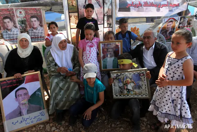 Palestinian Prime Minister, Salam Fayyad, attends a rally in the West Bank town of Tubas, to show solidarity with Palestinian prisoners held in Israeli jails on May 7, 2012. At least 1,550 Palestinian prisoners are refus...