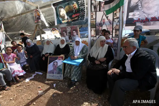 Palestinian Prime Minister, Salam Fayyad, attends a rally in the West Bank town of Tubas, to show solidarity with Palestinian prisoners held in Israeli jails on May 7, 2012. At least 1,550 Palestinian prisoners are refus...