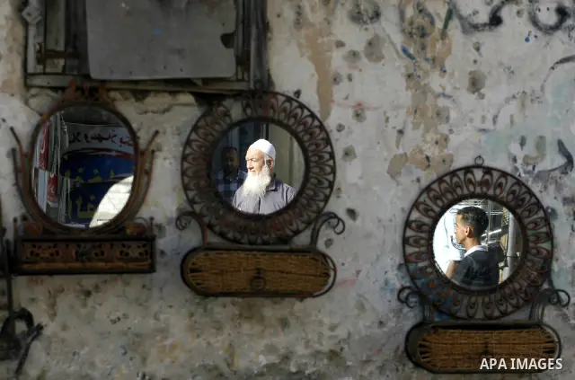 Palestinians participate in a rally supporting Palestinian inmates on hunger strike since mid-April 2012, in the Rafah in southern Gaza Strip, May 8, 2012. A Palestinian rights group said recently that half of about 5,00...