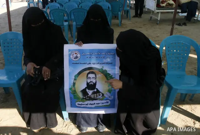 Palestinian Women participate in a rally supporting Palestinian inmates on hunger strike since mid-April 2012, in the Rafah in southern Gaza Strip, May 8, 2012. A Palestinian rights group said recently that half of about...