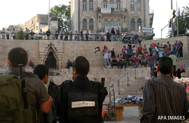 Palestinians carry Palestinian flags during a rally calling for unity and change in east Jerusalem on May 8, 2012. Photo by Mahfouz Abu Turk