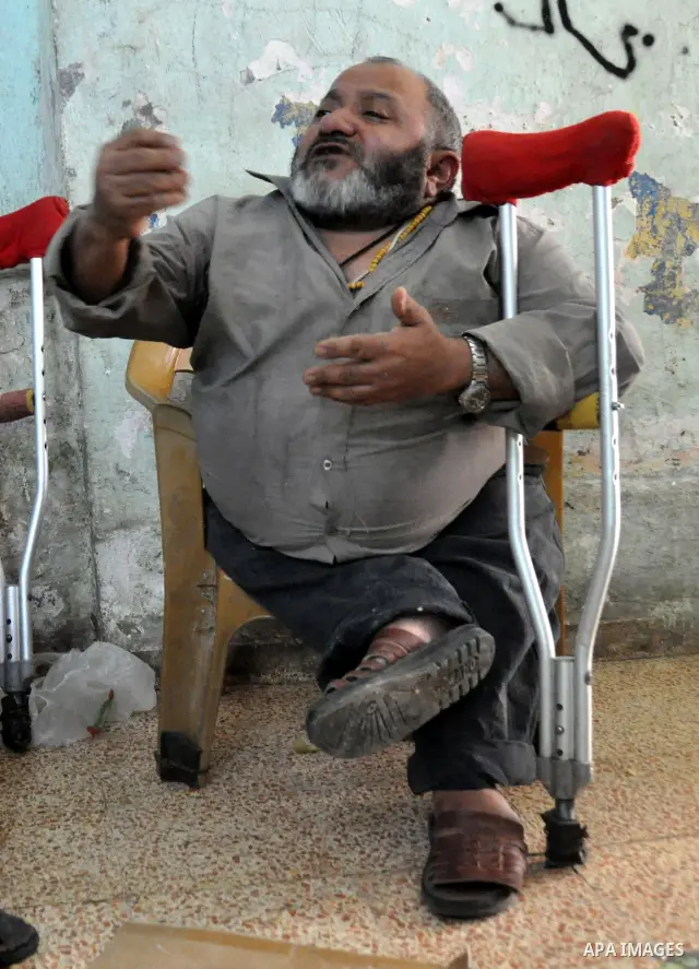 Marwan Abedah, a 58-year-old Palestinian refugee, leave their home in the alleys of the Askar refugee camp in the West Bank City of Nablus, 06 May 2012. The Abedah family, which has three handicapped relatives including...