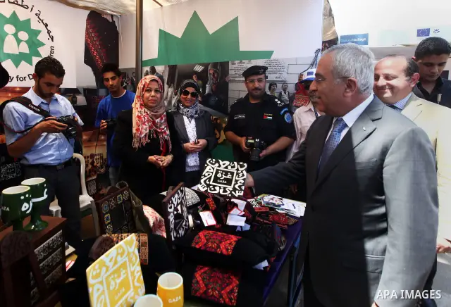 Palestinian Prime Minister Salam Fayyad, participates in a ceremony of the celebration "Europe Day", in the West Bank city of Ramallah, on May 09, 2012. Photo by Mustafa Abu Dayeh