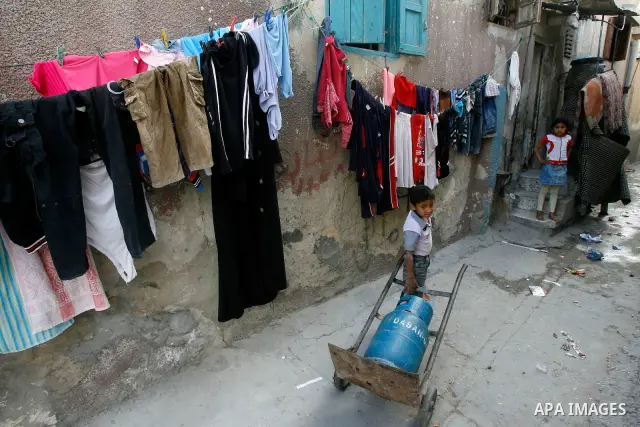 A Palestinian children in front of their house in the Rafah refugee camp in the southern area of the Gaza Strip on May 09 2012. On May 15 Palestinians will mark "Nakba," or catastrophe, of Israel's founding in a 1948 war...
