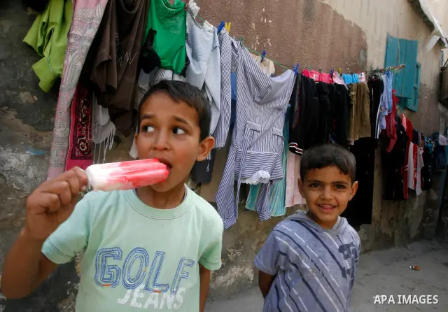 A Palestinian children play in front of their house in the Rafah refugee camp in the southern area of the Gaza Strip on May 09 2012. On May 15 Palestinians will mark "Nakba," or catastrophe, of Israel's founding in a 194...