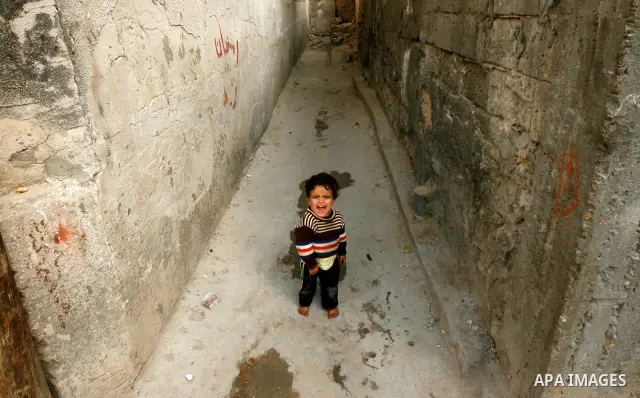 A Palestinian child plays in front of his house in the Rafah refugee camp in the southern area of the Gaza Strip on May 09 2012. On May 15 Palestinians will mark "Nakba," or catastrophe, of Israel's founding in a 1948 wa...