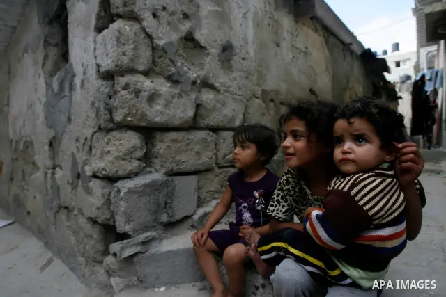 A Palestinian children play in front of their house in the Rafah refugee camp in the southern area of the Gaza Strip on May 09 2012. On May 15 Palestinians will mark "Nakba," or catastrophe, of Israel's founding in a 194...