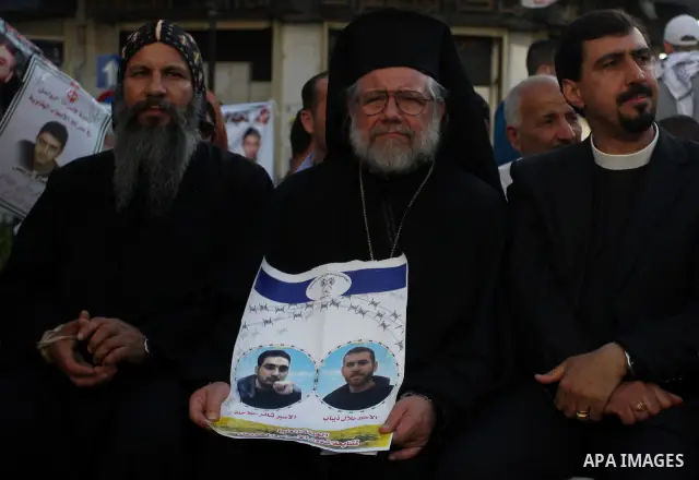 Palestinians participate in a rally supporting Palestinian inmates on hunger strike since mid-April 2012, in the West Bank City of Ramallah, May 9, 2012. A Palestinian rights group said recently that half of about 5,000...
