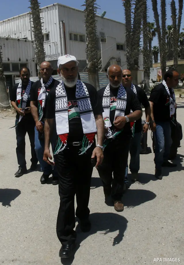 Palestinians delegation of released prisoners, leave the Rafah border crossing in the southern Gaza Strip on May 10, 2012. delegation will meet with Secretary General of the League of Arab States, Nabil Al Arabi, in Cair...