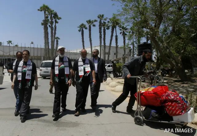 Palestinians delegation of released prisoners, leave the Rafah border crossing in the southern Gaza Strip on May 10, 2012. delegation will meet with Secretary General of the League of Arab States, Nabil Al Arabi, in Cair...