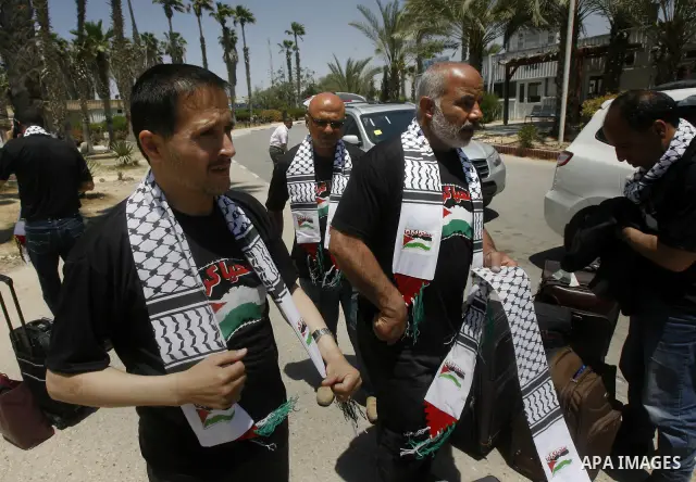 Palestinians delegation of released prisoners, leave the Rafah border crossing in the southern Gaza Strip on May 10, 2012. delegation will meet with Secretary General of the League of Arab States, Nabil Al Arabi, in Cair...