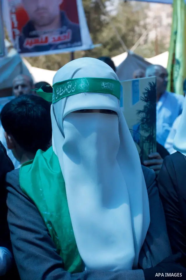 Palestinian woman performs Friday prayers during a sit-in, in the West Bank city of Nablus, May 11, 2012. Palestinians held in prayer outside a tent, in solidarity with prisoners who have been waging a hunger strike in I...