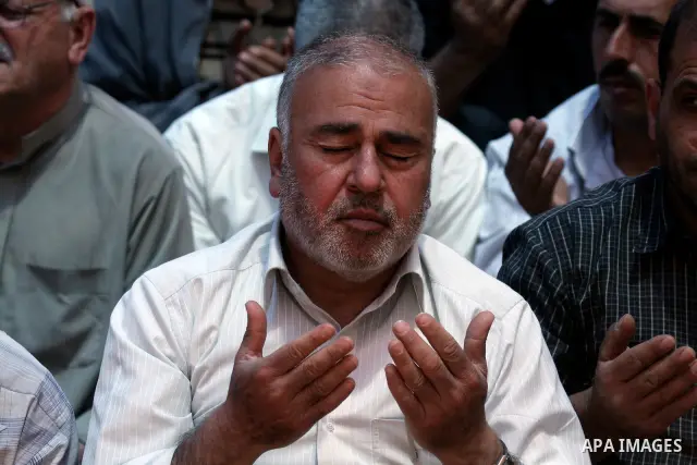 Palestinians perform Friday prayers during a sit-in, in the West Bank city of Nablus, May 11, 2012. Palestinians held in prayer outside a tent, in solidarity with prisoners who have been waging a hunger strike in Israeli...