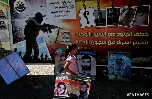 Palestinians gather in the protest tent in Gaza City in support of more than a thousand prisoners who are on an open-ended hunger strike in Israeli jails on May 11, 2012. At least 1,550 Palestinian prisoners are now on h...