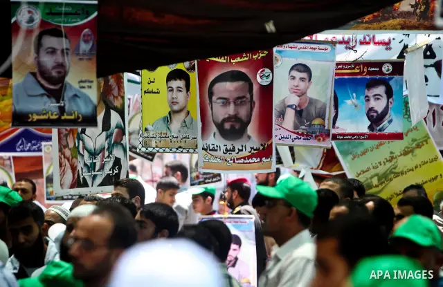 Palestinians attend Friday prayers in Gaza City in support of more than a thousand prisoners who are on an open-ended hunger strike in Israeli jails on May 11, 2012. At least 1,550 Palestinian prisoners are now on hunger...