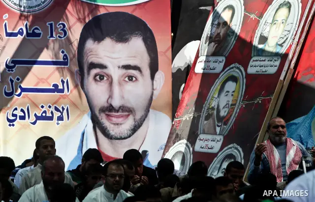 Palestinians attend Friday prayers in Gaza City in support of more than a thousand prisoners who are on an open-ended hunger strike in Israeli jails on May 11, 2012. At least 1,550 Palestinian prisoners are now on hunger...
