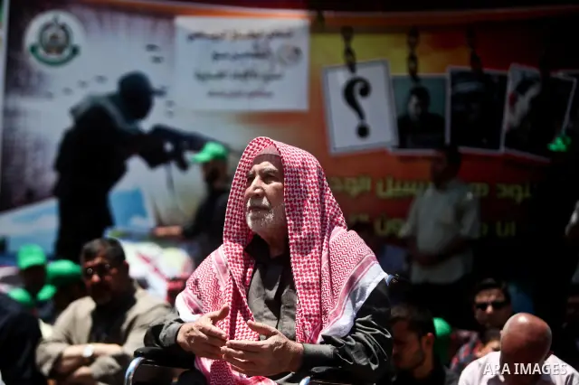 Palestinians attend Friday prayers in Gaza City in support of more than a thousand prisoners who are on an open-ended hunger strike in Israeli jails on May 11, 2012. At least 1,550 Palestinian prisoners are now on hunger...