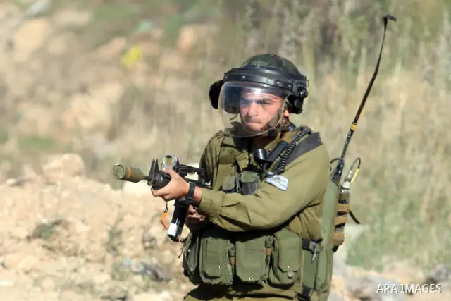 Israeli soldiers fire teargas canisters during clashes with Palestinian protesters outside the Ofer Prison near the West Bank city of Ramallah on May 11, 2012 following a demonstration in support of Palestinian prisoners...