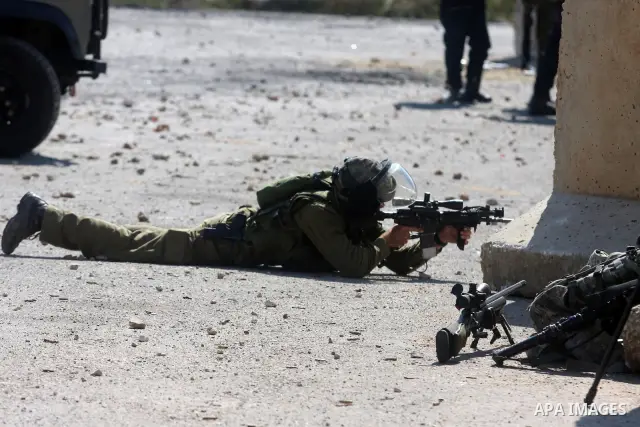 Israeli soldiers fire teargas canisters during clashes with Palestinian protesters outside the Ofer Prison near the West Bank city of Ramallah on May 11, 2012 following a demonstration in support of Palestinian prisoners...
