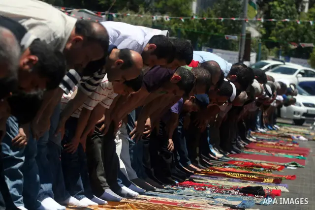 Palestinians perform Friday prayers during a sit-in, in the West Bank city of Ramallah, May 11, 2012. Palestinians held in prayer outside a tent, in solidarity with prisoners who have been waging a hunger strike in Israe...