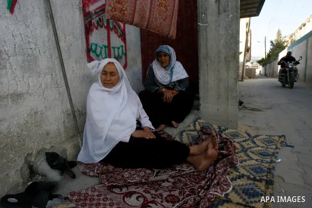 Palestinian old women are seen in front of their house, during a Hamas rally ahead of Nakba, in Rafah refugee camp, Gaza City, 11 May 2012. Palestinians mark the 64rd anniversary of 'Nakba', or catastrophe, in reference...