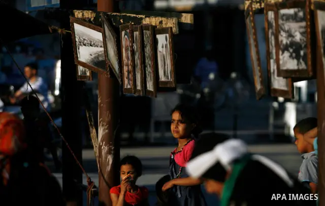 Palestinian children are seen during a Hamas rally ahead of Nakba, in Rafah refugee camp, Gaza City, 11 May 2012. Palestinians mark the 64rd anniversary of 'Nakba', or catastrophe, in reference to the creation of the sta...