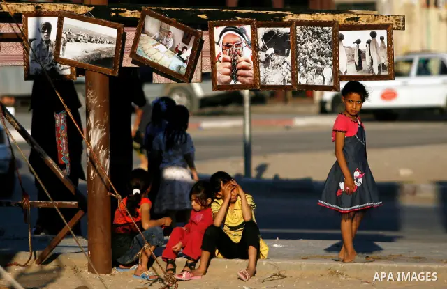 Palestinian children are seen during a Hamas rally ahead of Nakba, in Rafah refugee camp, Gaza City, 11 May 2012. Palestinians mark the 64rd anniversary of 'Nakba', or catastrophe, in reference to the creation of the sta...
