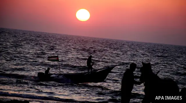 Palestinians enjoy a day on the beach of Khan Yunis, south of the Gaza Strip, on May 12, 2012. Photo by Ashraf Amra