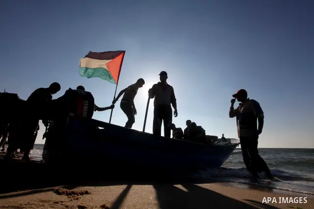Palestinians enjoy a day on the beach of Khan Yunis, south of the Gaza Strip, on May 12, 2012. Photo by Ashraf Amra