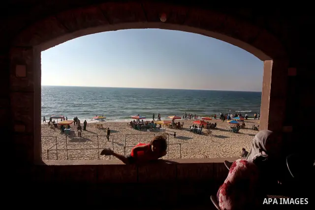 Palestinians enjoy beach in a newly-opened touristic resort in Khan Yunis, south of the Gaza Strip, on May 12, 2012. Photo by Ashraf Amra