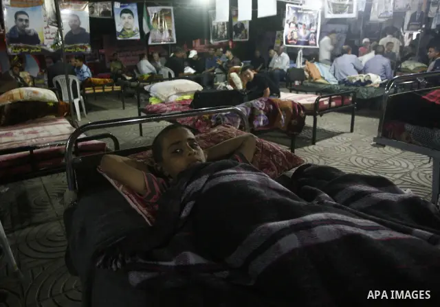 Palestinians attend a rally in Gaza City, to show solidarity with Palestinian prisoners held in Israeli jails on May 7, 2012. At least 1,550 Palestinian prisoners are refusing food in Israeli jails in a protest against t...